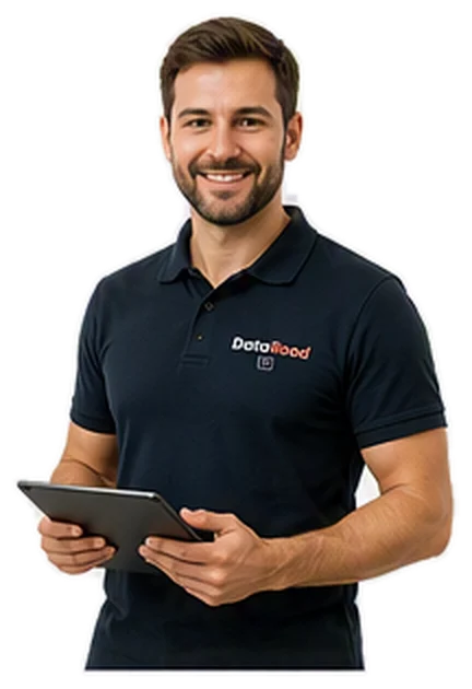 Smiling man in a dark polo shirt holding a tablet, suggesting a staff member ready to assist.